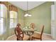 Charming breakfast nook provides a cozy spot to enjoy the morning light at 7115 Boca Grove Pl # 204, Lakewood Ranch, FL 34202