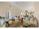 Open floor plan with spacious living room, leading into the dining room and kitchen, perfect for entertaining at 7115 Boca Grove Pl # 204, Lakewood Ranch, FL 34202