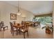 Open concept living and dining area with beautiful views and seamless access to the balcony at 7115 Boca Grove Pl # 204, Lakewood Ranch, FL 34202