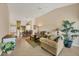 The open-concept living space showcases a comfortable living room, dining area, and stylish decor at 7115 Boca Grove Pl # 204, Lakewood Ranch, FL 34202