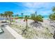 Beachfront backyard featuring palm trees and clear blue ocean views at 722 N Manasota Key Rd, Englewood, FL 34223