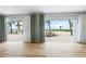 Living room view through sliding glass doors leads to a beautiful beachfront patio and the ocean at 722 N Manasota Key Rd, Englewood, FL 34223