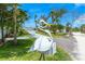 Close-up of a novelty pelican mailbox in front of a well-maintained, landscaped yard at 722 N Manasota Key Rd, Englewood, FL 34223