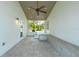 Covered patio with tile floors and seating overlooking lush tropical foliage at 722 N Manasota Key Rd, Englewood, FL 34223