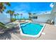 Inviting pool area with seating, with an outdoor dining table and beach views at 722 N Manasota Key Rd, Englewood, FL 34223