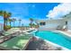 Backyard pool with beach views, surrounded by a spacious deck with seating at 722 N Manasota Key Rd, Englewood, FL 34223