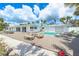 Inviting backyard with a refreshing pool and ample seating at 722 N Manasota Key Rd, Englewood, FL 34223
