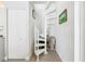 The spiral staircase is adjacent to the kitchen area and leads up to the second floor at 722 N Manasota Key Rd, Englewood, FL 34223