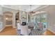 Inviting living room with fireplace, built-in shelving, and sliding doors that lead to the lanai and pool at 7305 Chatsworth Ct, University Park, FL 34201