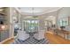 Cozy living room with fireplace, built-in shelving, and views of the pool and backyard creating a relaxing space at 7305 Chatsworth Ct, University Park, FL 34201