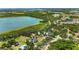 Aerial view of a lakeside community with lush greenery and waterfront views at 7407 91St E St, Palmetto, FL 34221
