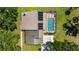 Aerial view of property with pool, patio and solar panels at 7407 91St E St, Palmetto, FL 34221