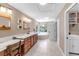Bright bathroom with double sinks, quartz countertop, custom mirrors and soaking tub at 7407 91St E St, Palmetto, FL 34221