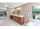 Bright bathroom with double sinks, quartz countertop, custom mirrors, tub and walk-in shower at 7407 91St E St, Palmetto, FL 34221