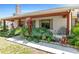 Inviting front porch area with vibrant landscaping and comfortable seating at 7407 91St E St, Palmetto, FL 34221