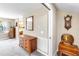 Hallway with a wooden dresser and mirror, leading to other rooms in the home at 7407 91St E St, Palmetto, FL 34221