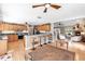 Well-lit eat-in kitchen with bar seating adjacent to living room at 7407 91St E St, Palmetto, FL 34221