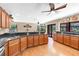 Bright kitchen featuring wooden cabinets, ample counter space, and view to pool area at 7407 91St E St, Palmetto, FL 34221