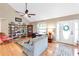 Spacious living room features a vaulted ceiling, hardwood floors, and ample natural light, perfect for relaxation at 7407 91St E St, Palmetto, FL 34221