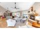 Inviting living room with a stone fireplace, wood floors, and comfortable seating at 7407 91St E St, Palmetto, FL 34221