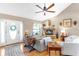 Cozy living room features a stone fireplace, wood floors, and ample natural light at 7407 91St E St, Palmetto, FL 34221