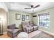 Comfortable living room with a ceiling fan, a window, and two reclining chairs at 7407 91St E St, Palmetto, FL 34221