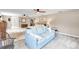 Spacious main bedroom featuring a comfortable seating area, ceiling fans, and ensuite bathroom at 7407 91St E St, Palmetto, FL 34221