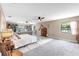 Open main bedroom with lots of space, ceiling fans, and windows offering natural light at 7407 91St E St, Palmetto, FL 34221