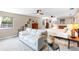 Bright main bedroom offering a seating area, large windows and hardwood dressers at 7407 91St E St, Palmetto, FL 34221