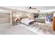 Spacious main bedroom features natural light, an ensuite, seating, and an open closet at 7407 91St E St, Palmetto, FL 34221