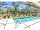 Lovely screened-in pool offers a peaceful retreat with serene views of the lush, landscaped backyard at 7407 91St E St, Palmetto, FL 34221