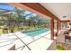 Beautiful screened-in pool with clear blue water and plenty of space for lounging in a private backyard at 7407 91St E St, Palmetto, FL 34221