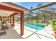 A stunning screened-in pool with a spacious patio area, perfect for outdoor relaxation and entertainment at 7407 91St E St, Palmetto, FL 34221