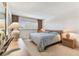 Cozy bedroom with neutral tones, soft lighting, and comfortable furnishings at 7461 W Country Club Dr N # 408, Sarasota, FL 34243