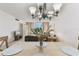 Cozy dining area with views to the living room and outside scenery at 7461 W Country Club Dr N # 408, Sarasota, FL 34243