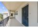 Hallway view showcasing unit 408's entrance with a dark front door, contrasted against the light hallway walls and flooring at 7461 W Country Club Dr N # 408, Sarasota, FL 34243