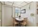 Cozy kitchen nook with a window, table, and chairs, creating a bright and comfortable dining space at 7461 W Country Club Dr N # 408, Sarasota, FL 34243