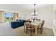 Spacious living area with a view of the balcony and golf course at 7461 W Country Club Dr N # 408, Sarasota, FL 34243