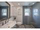 Modern bathroom features a glass shower, ample storage, and sleek fixtures for a spa-like retreat at 750 Tarawitt Dr, Longboat Key, FL 34228