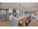 Bright, open kitchen featuring a large island with seating and modern appliances at 750 Tarawitt Dr, Longboat Key, FL 34228