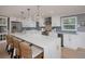 Modern kitchen featuring a large marble island and updated appliances, a culinary dream at 750 Tarawitt Dr, Longboat Key, FL 34228