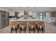 Spacious kitchen with a large island, stainless steel appliances, and stylish lighting at 750 Tarawitt Dr, Longboat Key, FL 34228