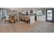 Open-concept kitchen with large island, dining area, and modern appliances at 750 Tarawitt Dr, Longboat Key, FL 34228