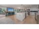 Bright, modern kitchen with stainless steel appliances, open to the living area at 750 Tarawitt Dr, Longboat Key, FL 34228