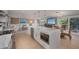 Well-equipped kitchen with open layout to living area, perfect for entertaining at 750 Tarawitt Dr, Longboat Key, FL 34228