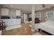Versatile living space including a kitchenette, seating area, and sleeping area with stylish decor at 750 Tarawitt Dr, Longboat Key, FL 34228