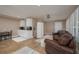 Open living space with kitchenette, comfortable seating, and neutral tones for a welcoming atmosphere at 750 Tarawitt Dr, Longboat Key, FL 34228