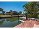 Scenic waterfront property with a private dock, perfect for boating, fishing, and enjoying serene water views at 750 Tarawitt Dr, Longboat Key, FL 34228