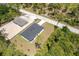 An aerial view highlights the property's layout and construction in a naturally landscaped, quiet setting at 7852 Tasco Dr, North Port, FL 34291