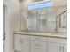 Spacious bathroom featuring a double sink vanity with granite countertops and a glass-enclosed shower at 7852 Tasco Dr, North Port, FL 34291